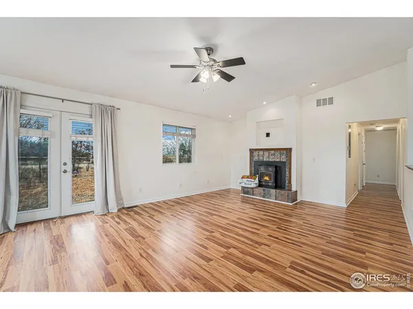 a kitchen with stainless steel appliances granite countertop a refrigerator a stove a sink and a microwave