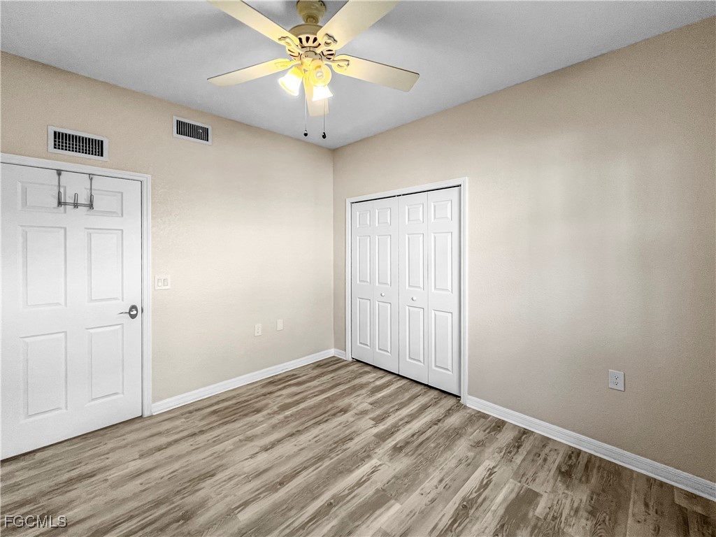 16285 Coco Hammock Way, Unit 101 Fort Myers, FL 33908 - Photo 13 of 50 a view of an empty room with a window