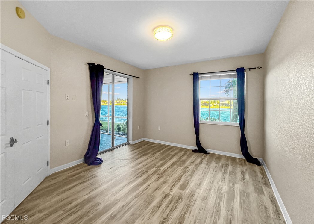 16285 Coco Hammock Way, Unit 101 Fort Myers, FL 33908 - Photo 25 of 50 a view of an empty room and window