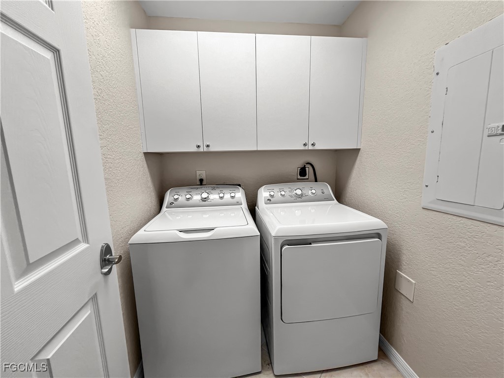 16285 Coco Hammock Way, Unit 101 Fort Myers, FL 33908 - Photo 29 of 50 a utility room with dryer and washer