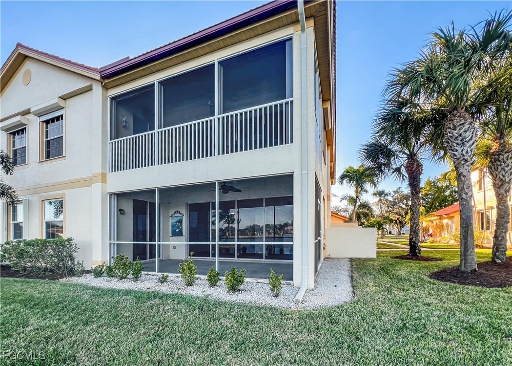 16285 Coco Hammock Way, Unit 101 Fort Myers, FL 33908 - Photo 37 of 50 a front view of a house with garden