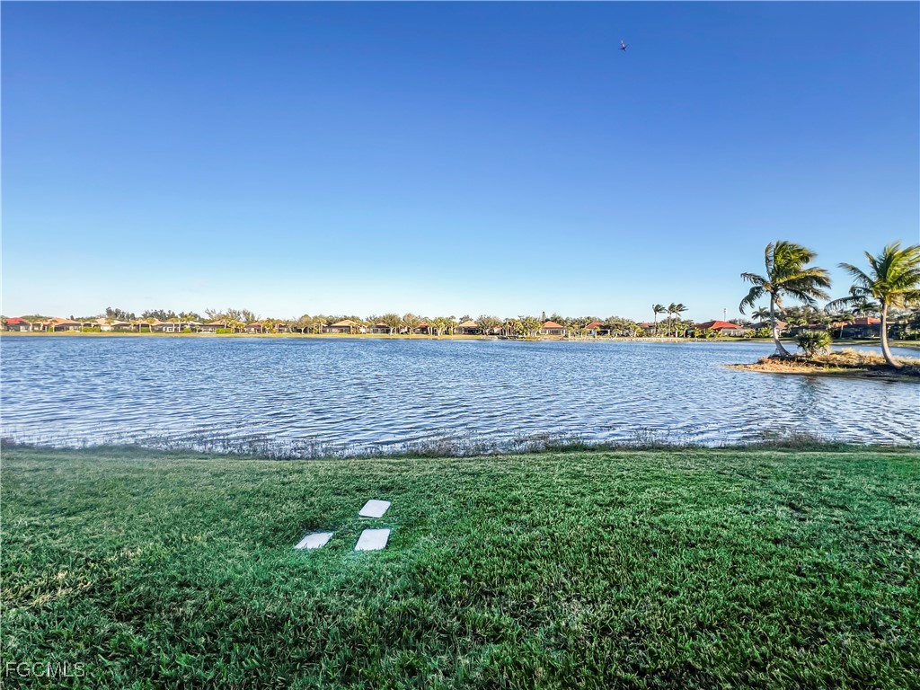 16285 Coco Hammock Way, Unit 101 Fort Myers, FL 33908 - Photo 38 of 50 a view of a field with ocean view