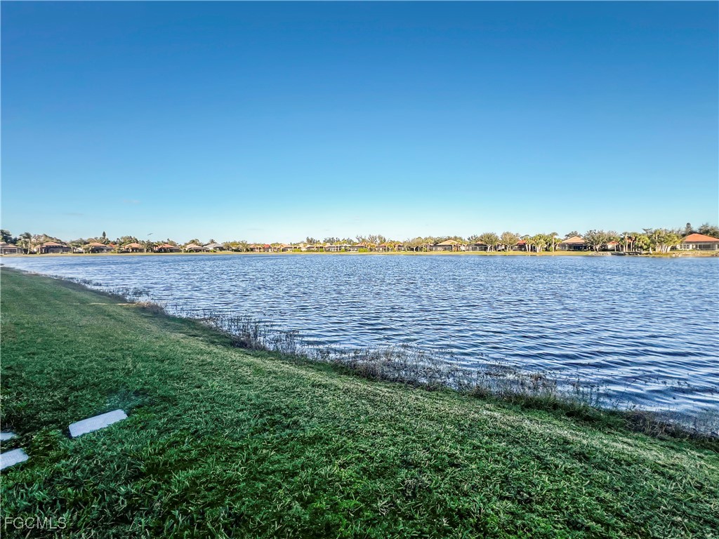 16285 Coco Hammock Way, Unit 101 Fort Myers, FL 33908 - Photo 39 of 50 a view of a yard with an ocean beach
