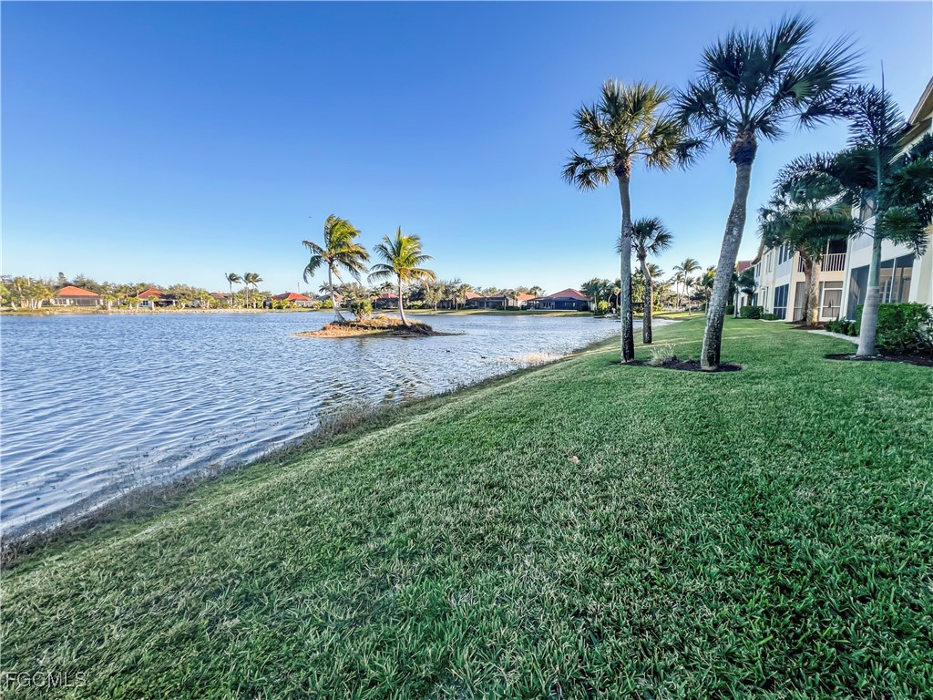 16285 Coco Hammock Way, Unit 101 Fort Myers, FL 33908 - Photo 40 of 50 a view of a garden and front view of a house