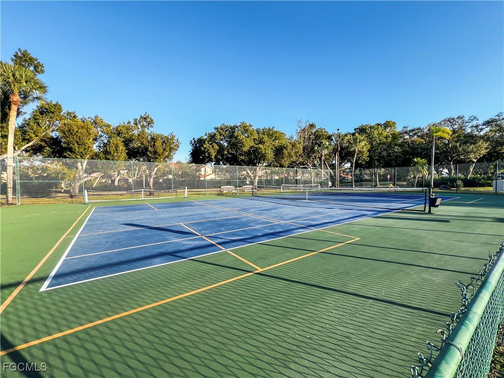 16285 Coco Hammock Way, Unit 101 Fort Myers, FL 33908 - Photo 50 of 50 a view of an outdoor space and tennis court