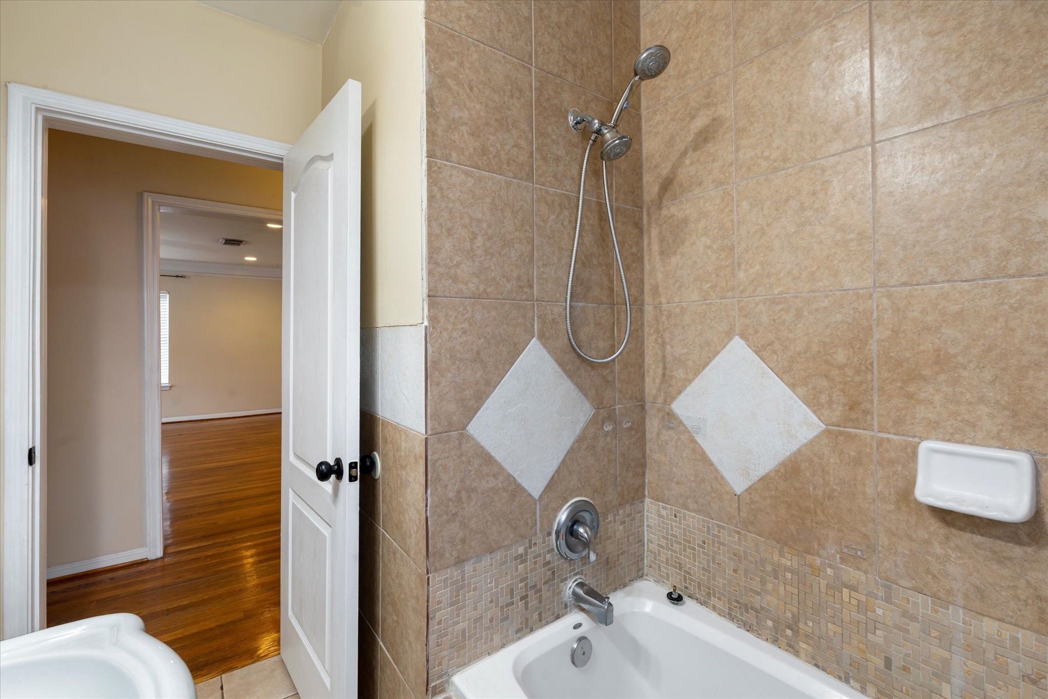 3005 Arbor Street, Unit B Houston, TX 77004 - Photo 14 of 22 a bathroom with a sink and a mirror