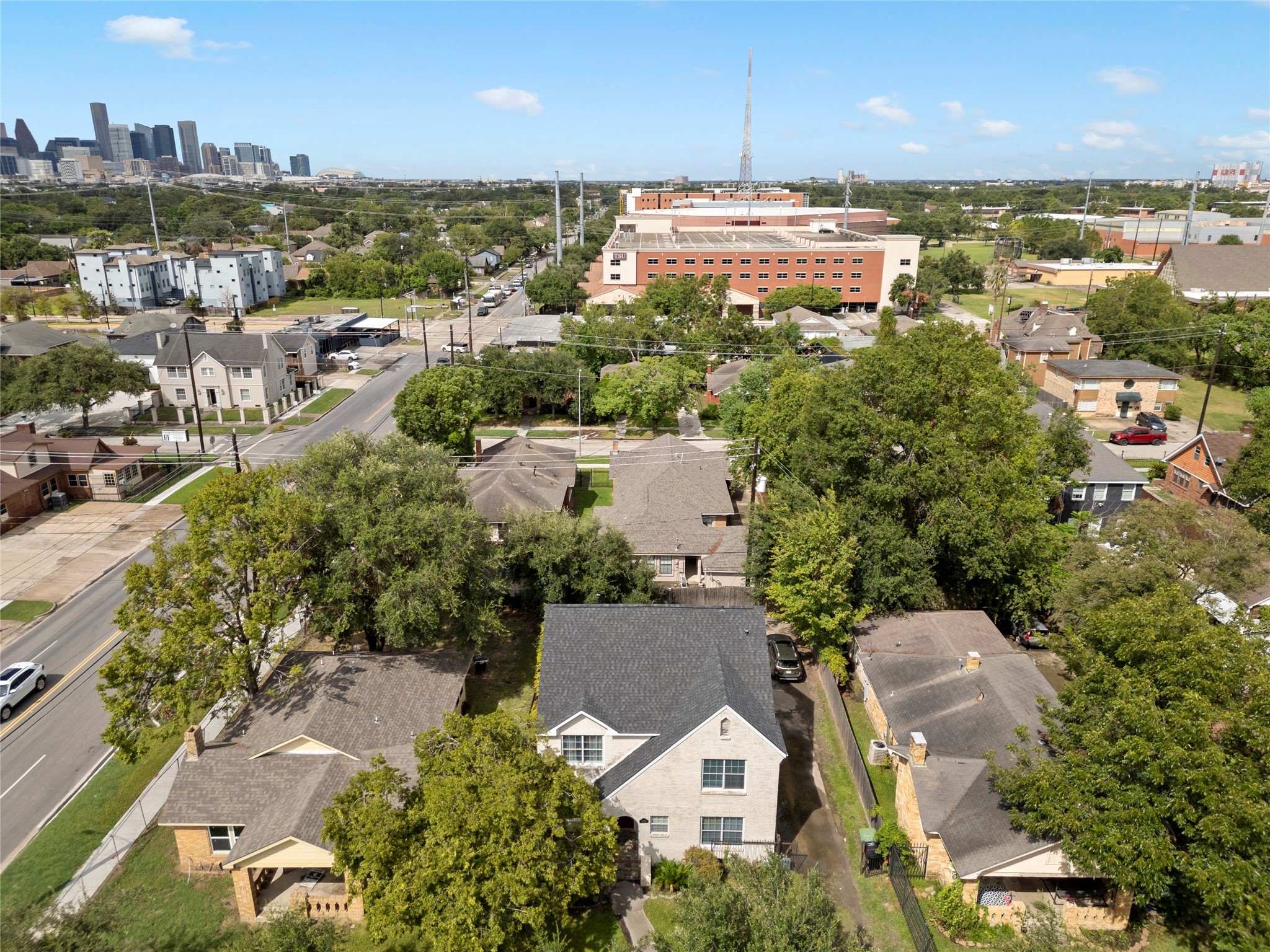 3005 Arbor Street, Unit B Houston, TX 77004 - Photo 19 of 22 an aerial view of a city with lots of residential buildings ocean and mountain view in back