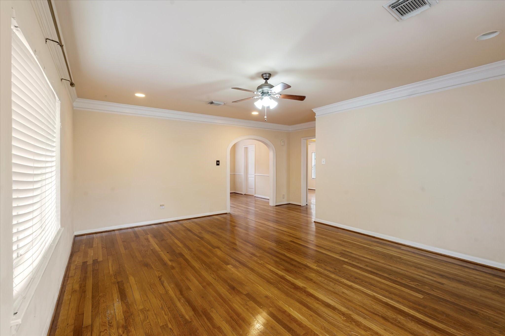 3005 Arbor Street, Unit B Houston, TX 77004 - Photo 7 of 22 wooden floor in an empty room with a window