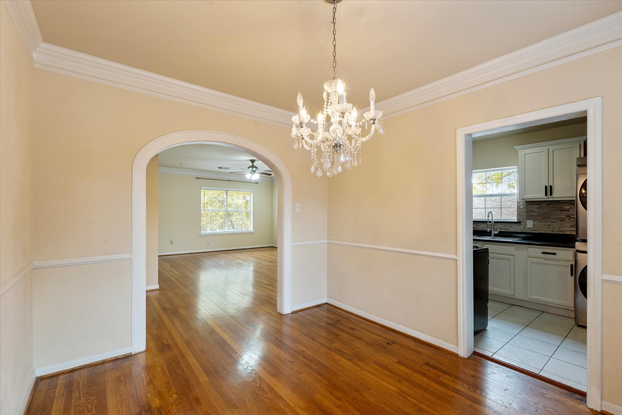 3005 Arbor Street, Unit B Houston, TX 77004 - Photo 8 of 22 a view of a kitchen with a dishwasher cabinets and a wooden floor