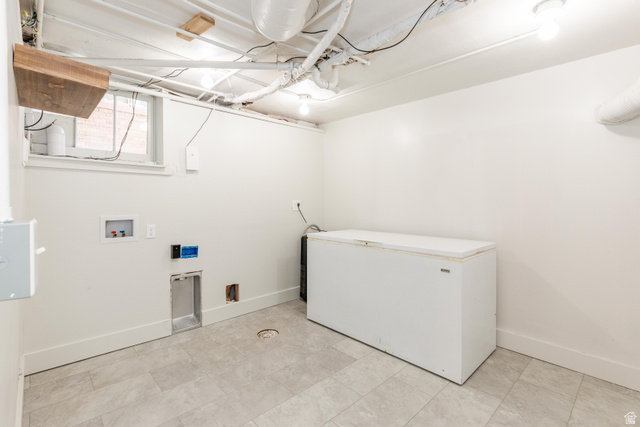 227 West 200 North Logan, UT 84321 - Photo 35 of 44 Utility space featuring light gray floor tiles and a white painted ceiling with large freezer