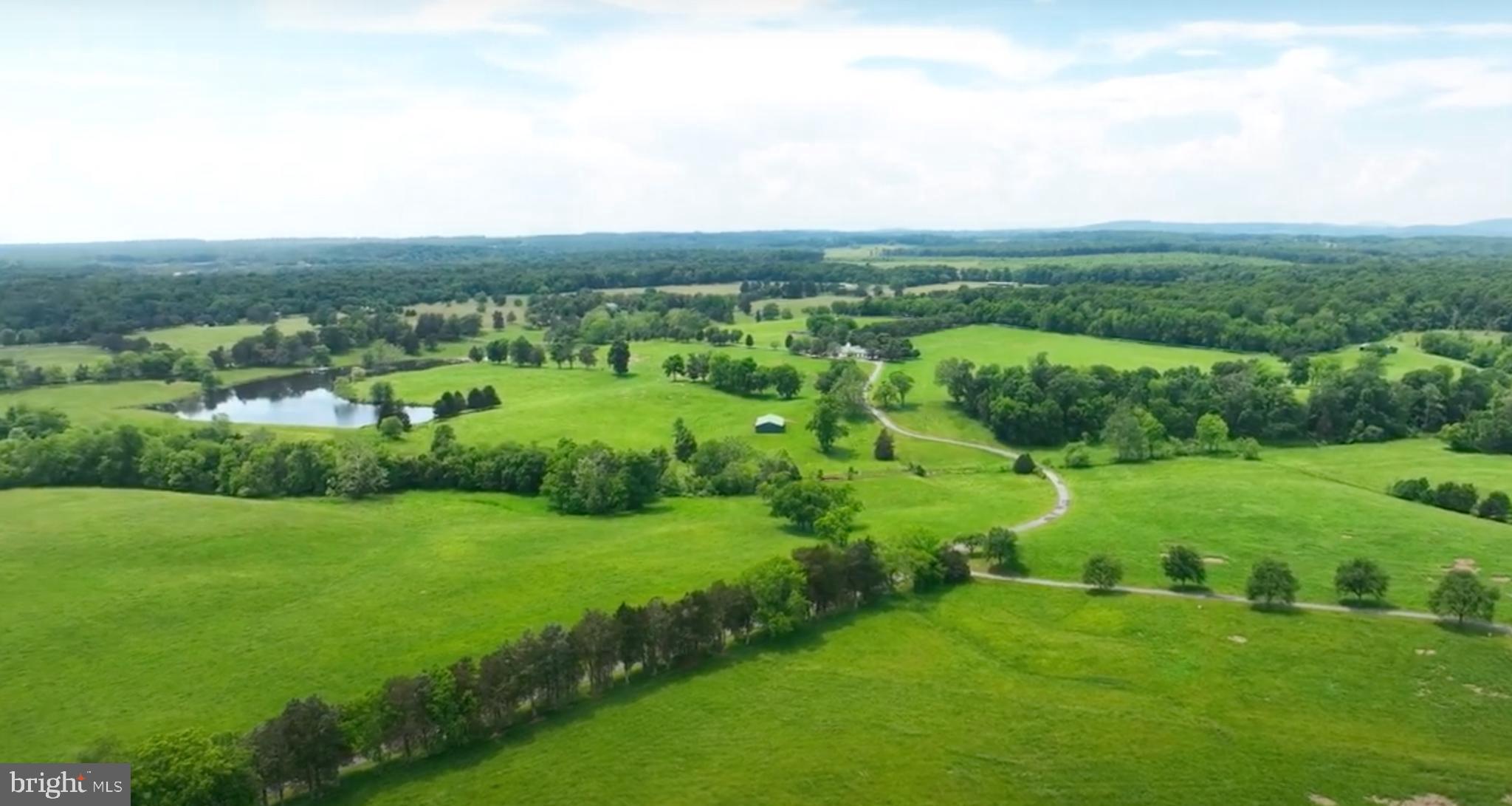 8792 Rogues Road Warrenton, VA 20187 - Photo 1 of 7 an aerial view of residential houses with outdoor space and trees