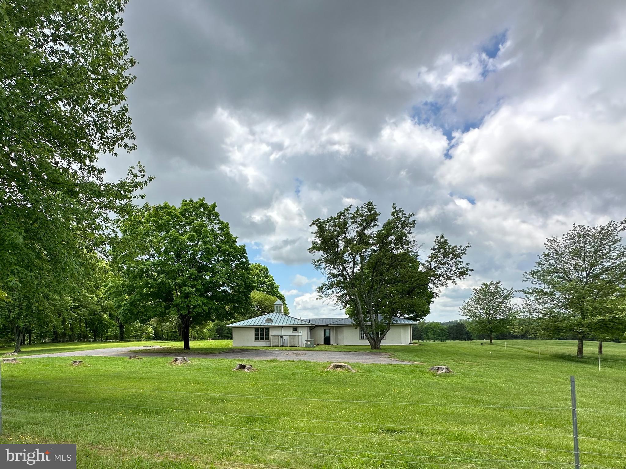 8792 Rogues Road Warrenton, VA 20187 - Photo 7 of 7 a big yard with lots of green space and garden