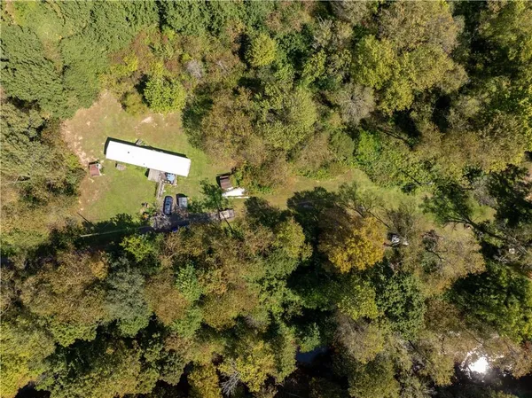 a view of a house with a tree
