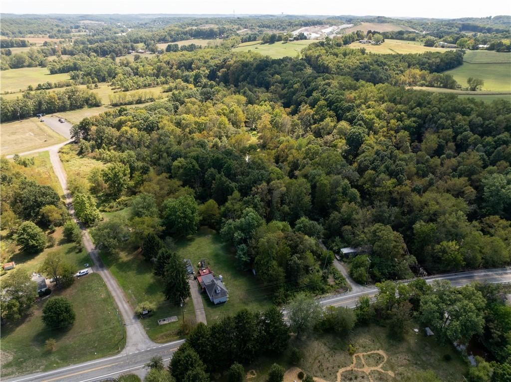1409 Highway 989 Rochester, PA 15074 - Photo 6 of 17 an aerial view of residential houses with outdoor space and trees