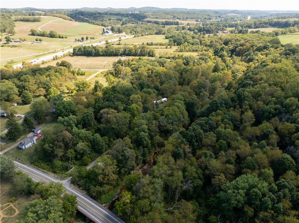 1409 Highway 989 Rochester, PA 15074 - Photo 7 of 17 an aerial view of residential houses with outdoor space and mountain view