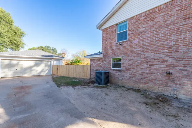 a view of backyard with swimming pool and outdoor seating