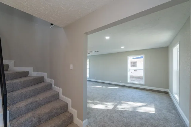 a view of entryway and hall with a window