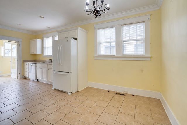 a bathroom with a bathtub and next to a window
