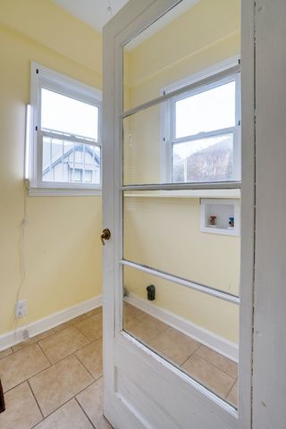 a view of room with window and hardwood floor