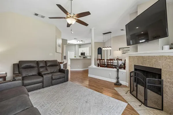 a living room with furniture and a fireplace