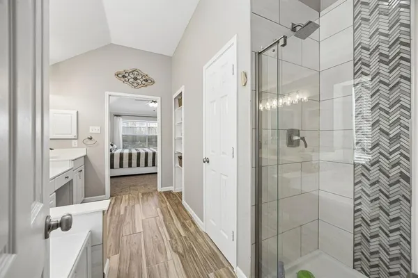 a bathroom with a shower and a sink