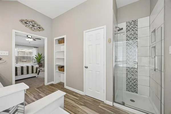 a bathroom with a bathtub and a shower