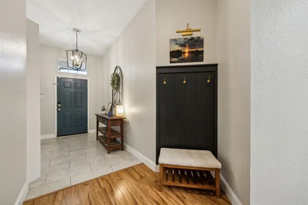 a room with wooden floor and furniture