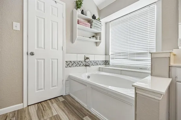 a room with window and ceiling fan