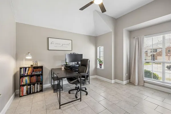 a workspace with furniture and a flat screen tv