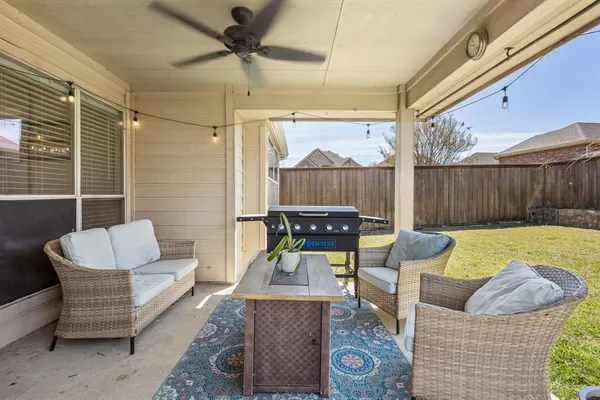 a front view of a house with a yard outdoor seating and barbeque oven