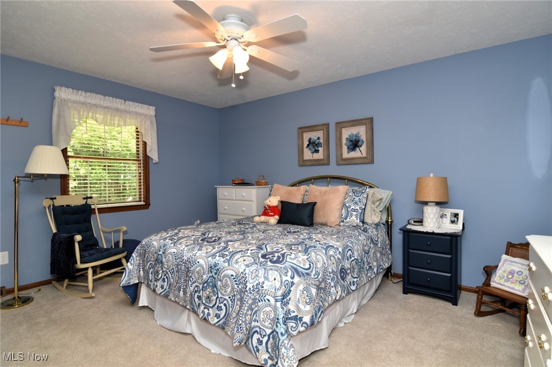 5510 Som Center Road Solon, OH 44139 - Photo 16 of 38 Carpeted bedroom with baseboards and ceiling fan