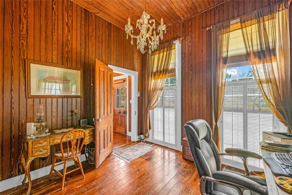 a balcony with table and chairs
