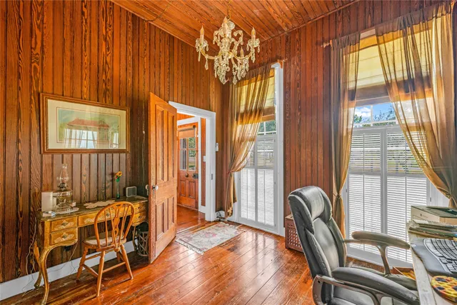 a balcony with table and chairs