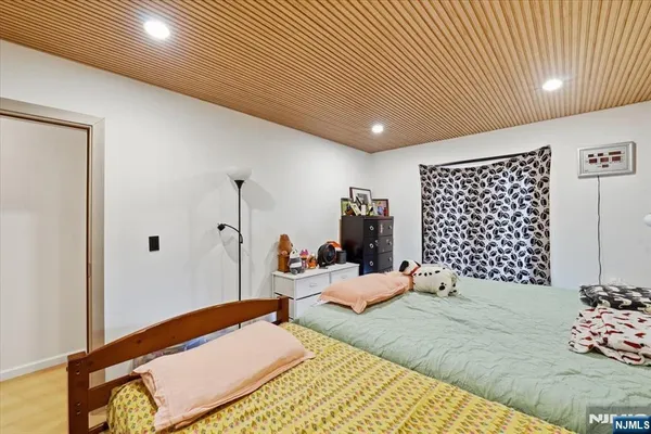 a bedroom with furniture and a bed