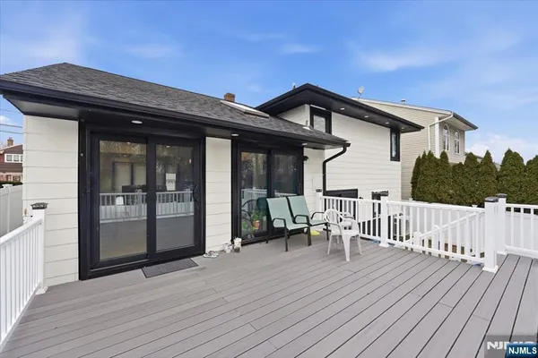 a view of a house with a yard covered in snow