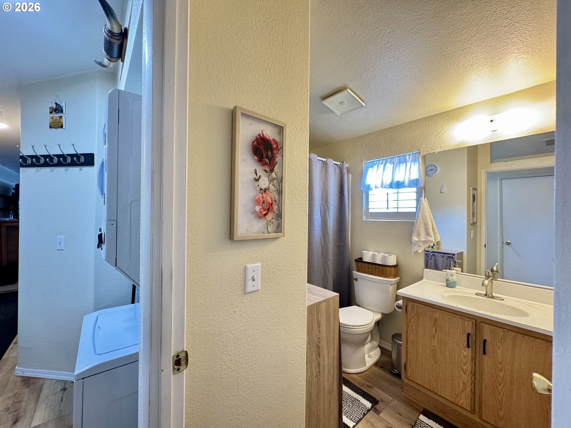3760 Highway 101, Unit 1 Florence, OR 97439 - Photo 10 of 32 a bathroom with a sink vanity mirror and toilet