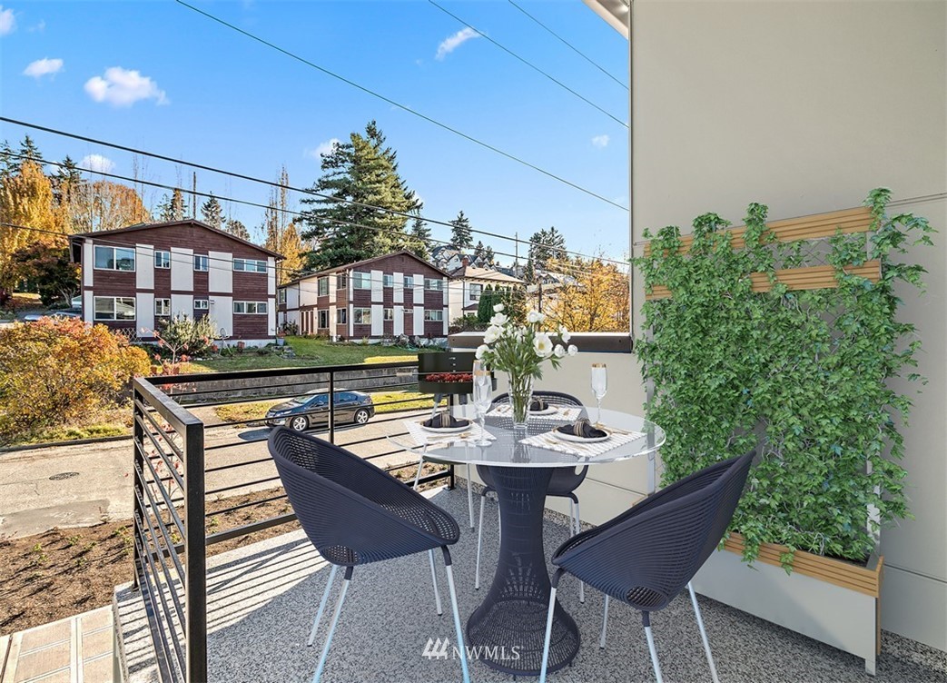 5517 4th Avenue Northwest Seattle, WA 98107 - Photo 2 of 18 a view of a chairs and table in the patio