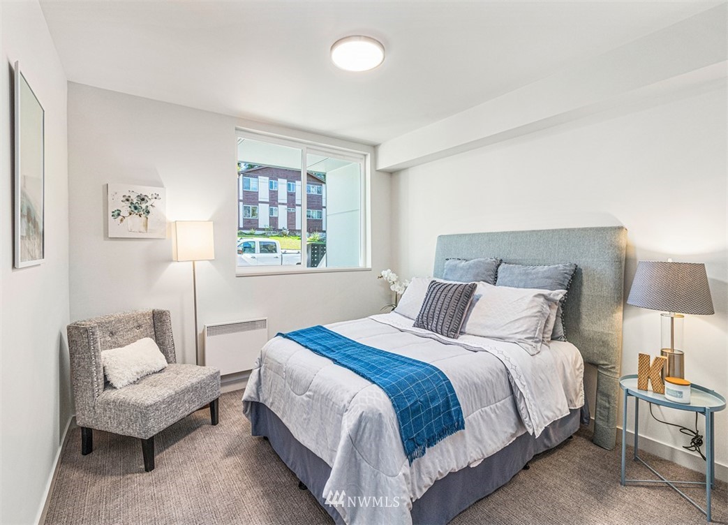 5517 4th Avenue Northwest Seattle, WA 98107 - Photo 12 of 18 a bedroom with a bed and a couch