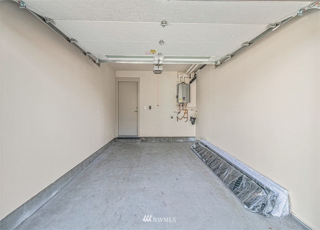 5517 4th Avenue Northwest Seattle, WA 98107 - Photo 16 of 18 a view of a hallway with staircase