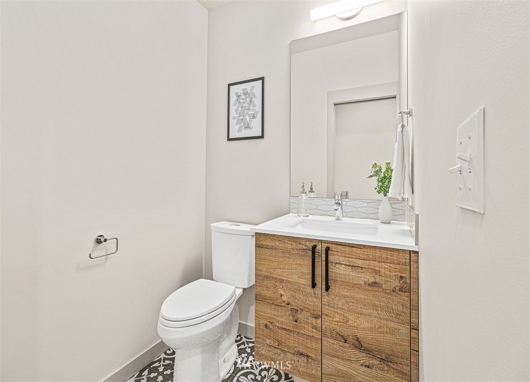 5517 4th Avenue Northwest Seattle, WA 98107 - Photo 6 of 18 a bathroom with a sink toilet and mirror