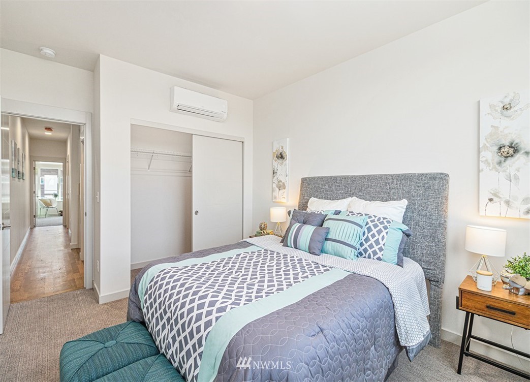 5517 4th Avenue Northwest Seattle, WA 98107 - Photo 8 of 18 a bedroom with a bed and a lamp
