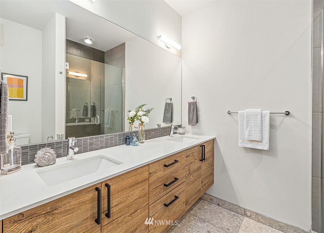 5517 4th Avenue Northwest Seattle, WA 98107 - Photo 9 of 18 a bathroom with a sink double vanity and a mirror