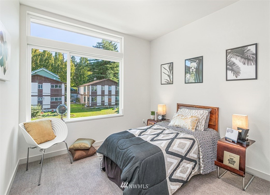5517 4th Avenue Northwest Seattle, WA 98107 - Photo 10 of 18 a bedroom with furniture and a large window