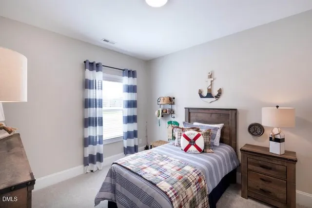 a bedroom with a bed and a bookshelf with wooden floor