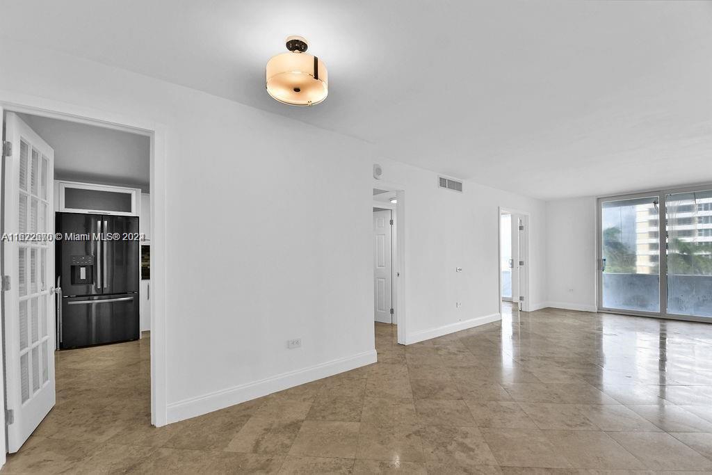 5555 Collins Avenue, Unit 5V Miami Beach, FL 33140 - Photo 15 of 46 a view of an empty room with a window