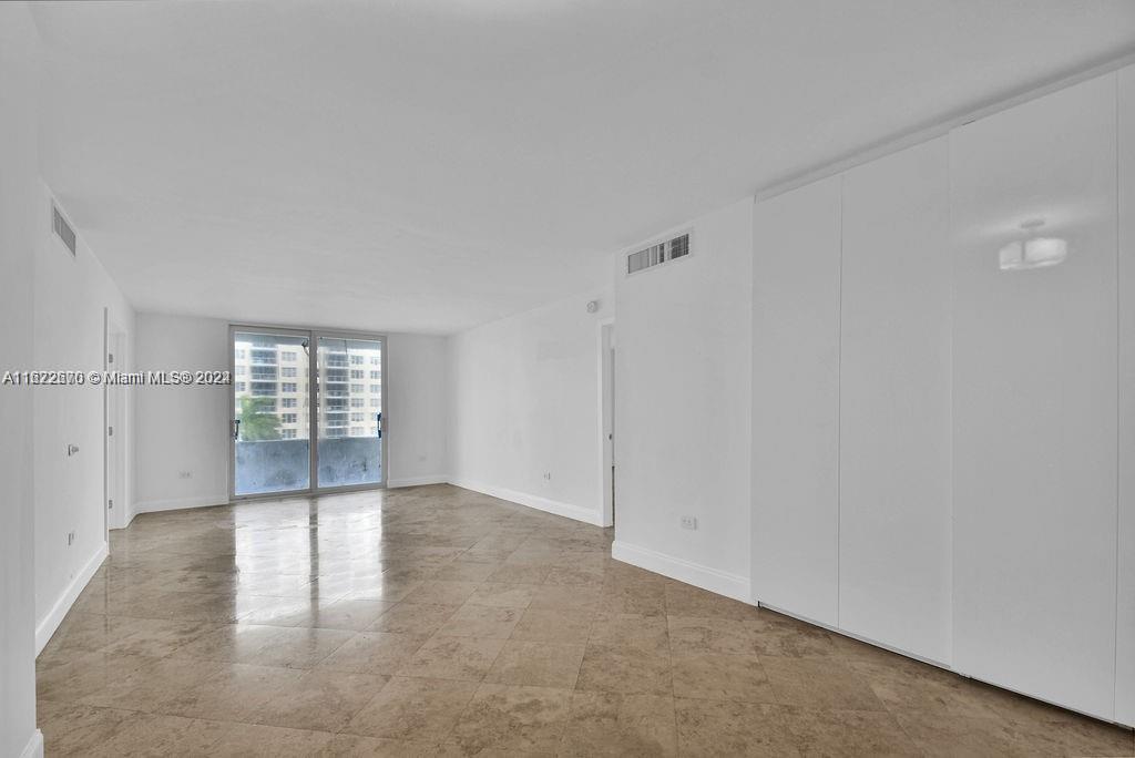 5555 Collins Avenue, Unit 5V Miami Beach, FL 33140 - Photo 17 of 46 a view of an empty room with a window