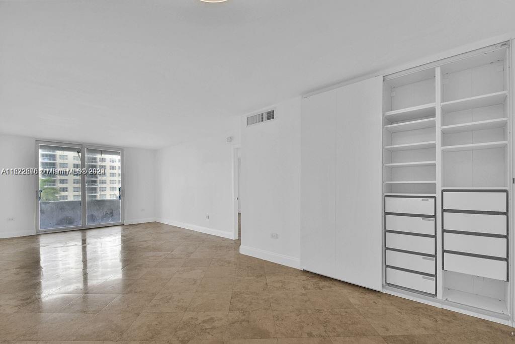 5555 Collins Avenue, Unit 5V Miami Beach, FL 33140 - Photo 18 of 46 a view of an empty room with a window