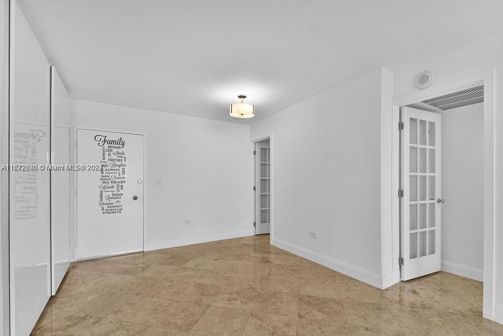 5555 Collins Avenue, Unit 5V Miami Beach, FL 33140 - Photo 19 of 46 a view of a room with an empty space