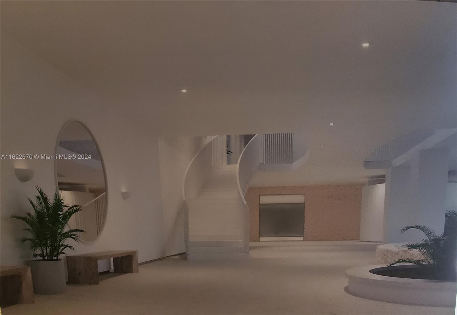 5555 Collins Avenue, Unit 5V Miami Beach, FL 33140 - Photo 39 of 46 a view of a hallway with a potted plant