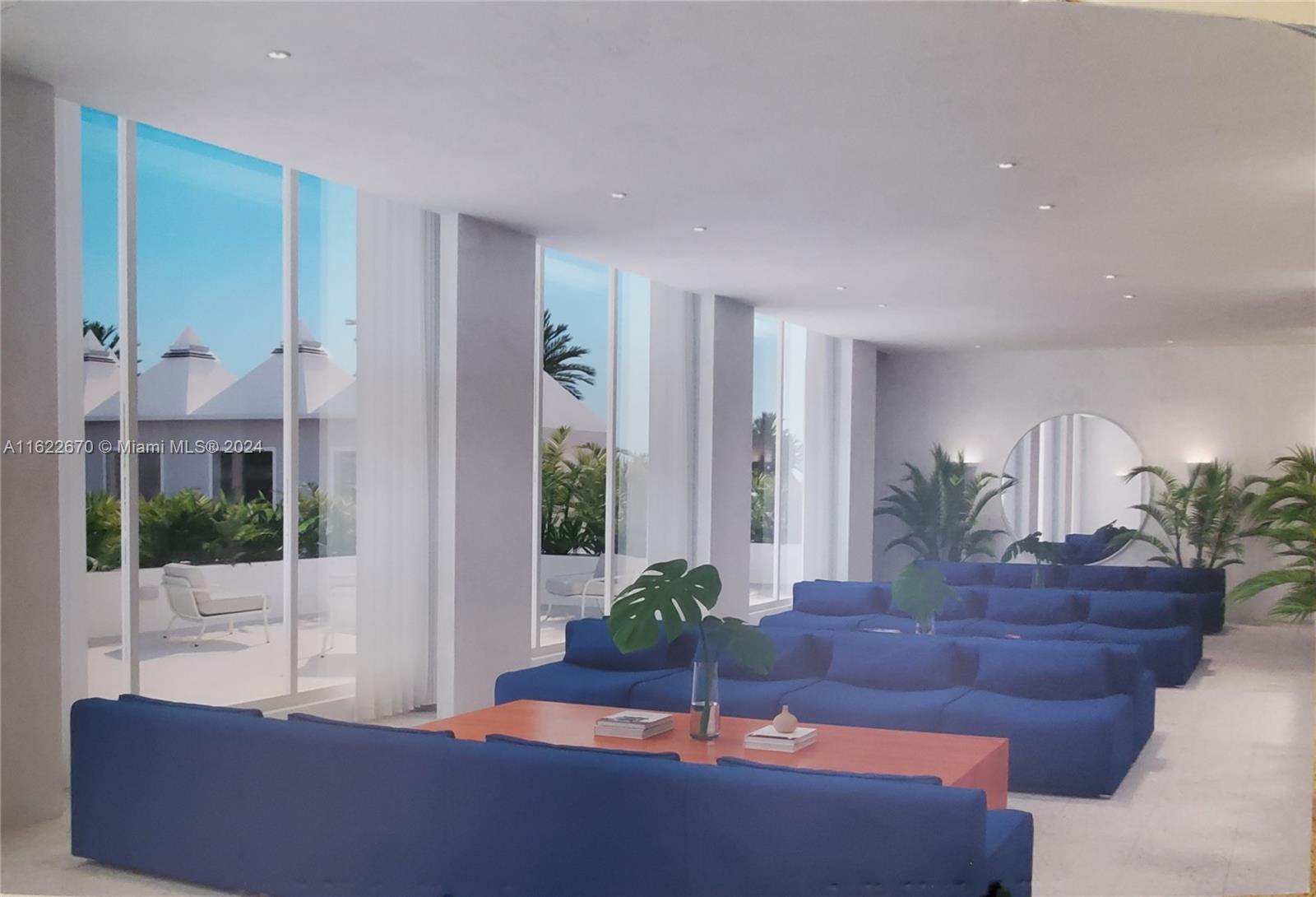 5555 Collins Avenue, Unit 5V Miami Beach, FL 33140 - Photo 42 of 46 a living room with furniture and a potted plant